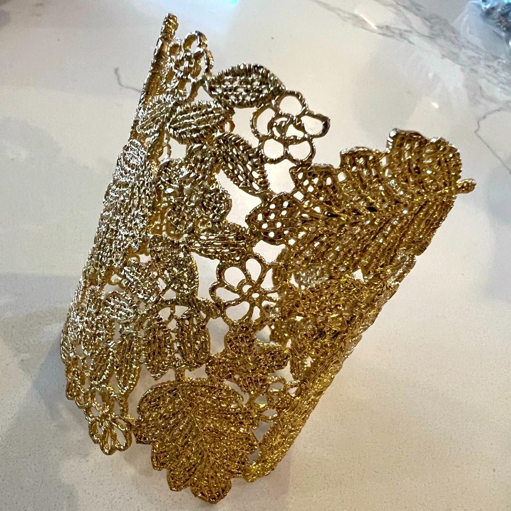 Stella and Dot gold cuff bracelet with beautiful milligram art work.